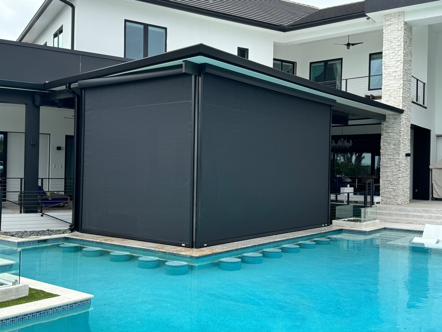 Custom Motorized Screens in Orlando, FL installed on a covered patio for sun protection